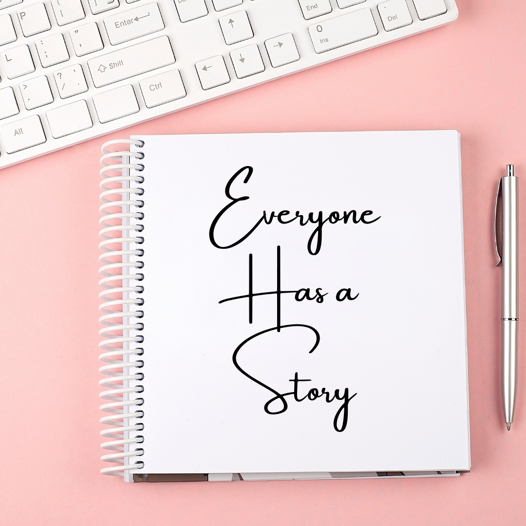 Everyone Has a Story Image of a notebook with the words, Everyone Has a Story written on it.